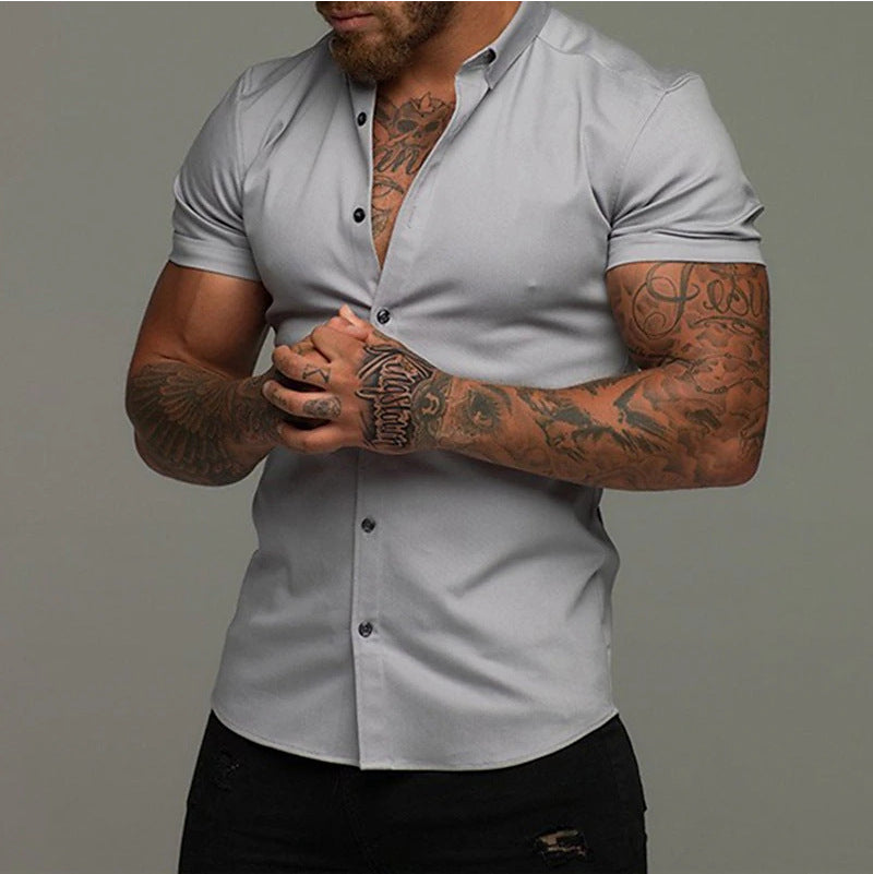 A muscular man in a solid-color lapel short-sleeved shirt
